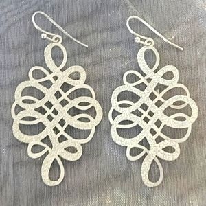 Silver bling swirl design drop earrings.